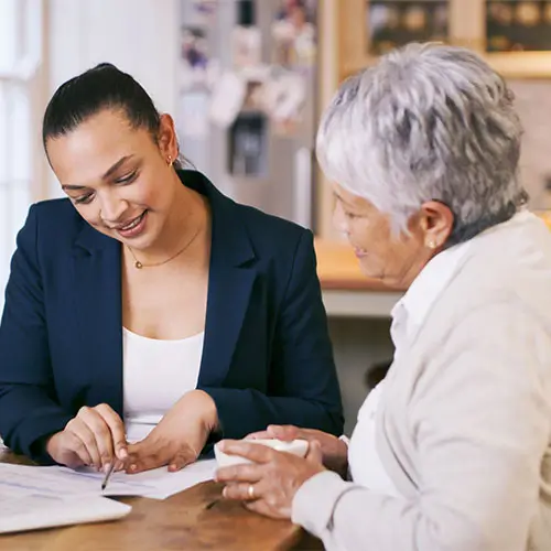 Agency staffer reviewing options with client